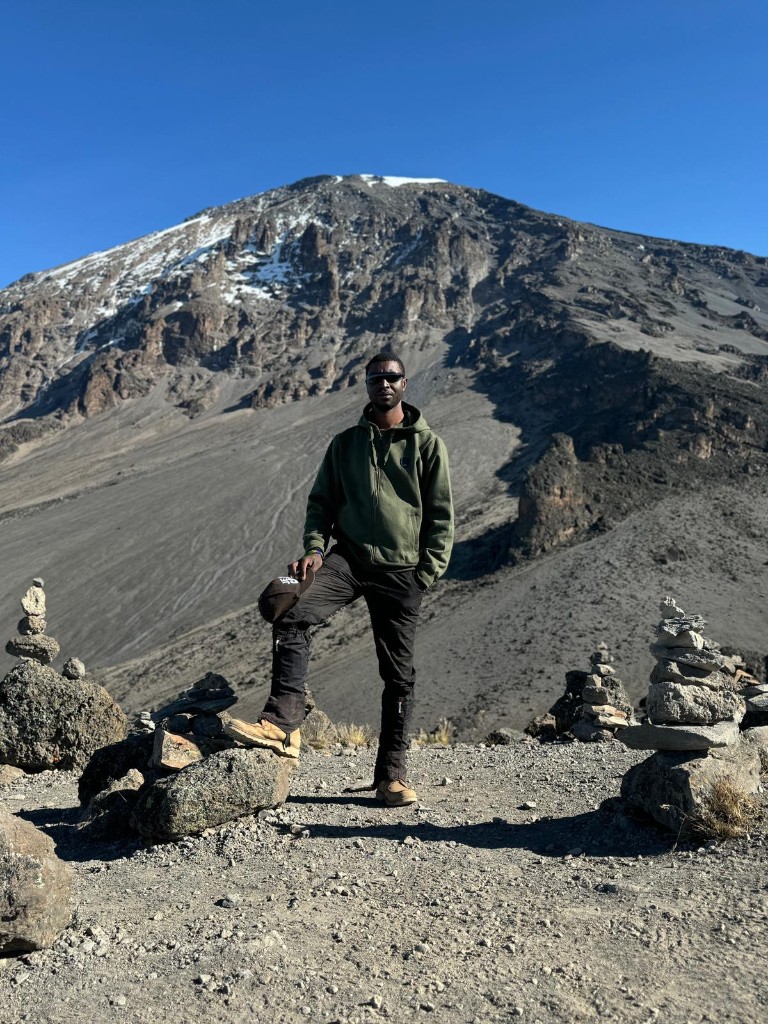 Godfrey Baltazary Lyimo on a mountain trail in Tanzania